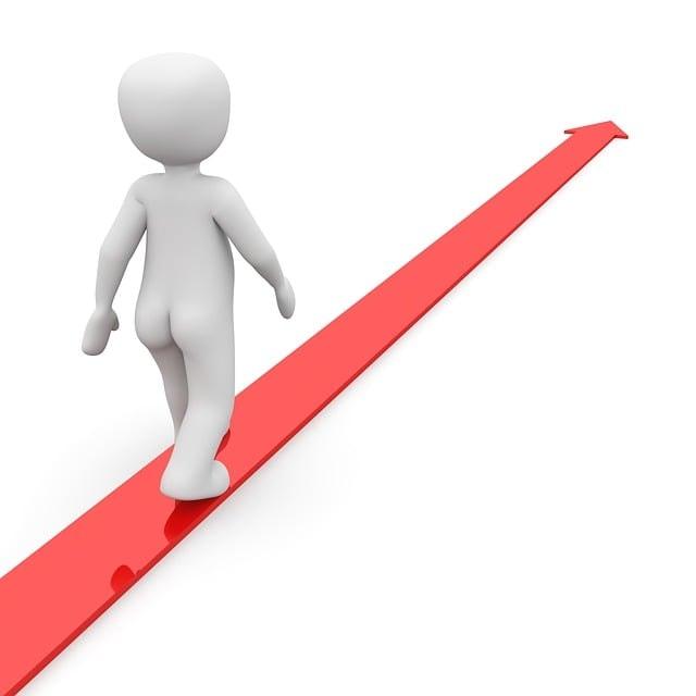 3D white humanoid figure walking forward on a red arrow pointing upward, symbolizing progress, direction, or growth.